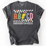 Charcoal gray t-shirt with ABCD Kindergarten Rocks graphic.