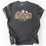 Gray t-shirt featuring colorful floral design and the text EMERGENCY nurse.
