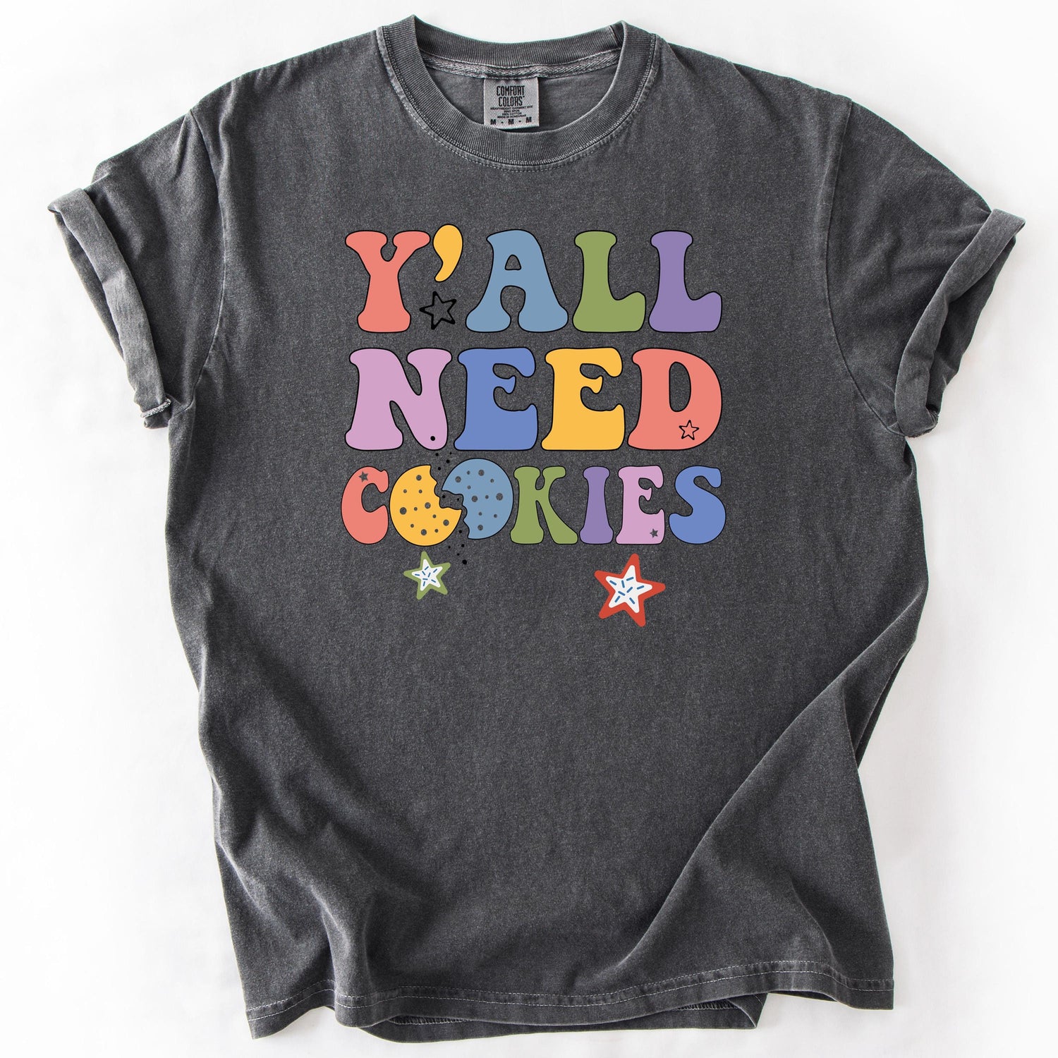 Gray graphic t-shirt with Y'All Need Cookies text in colorful letters.