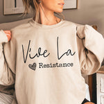 Beige oversized sweatshirt with Vive La Resistance print.