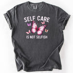 Gray graphic t-shirt with Self Care Is Not Selfish text and butterfly designs.