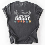 Charcoal gray, short-sleeve t-shirt with My Favorite People Call Me Nanny text and colorful hearts design.