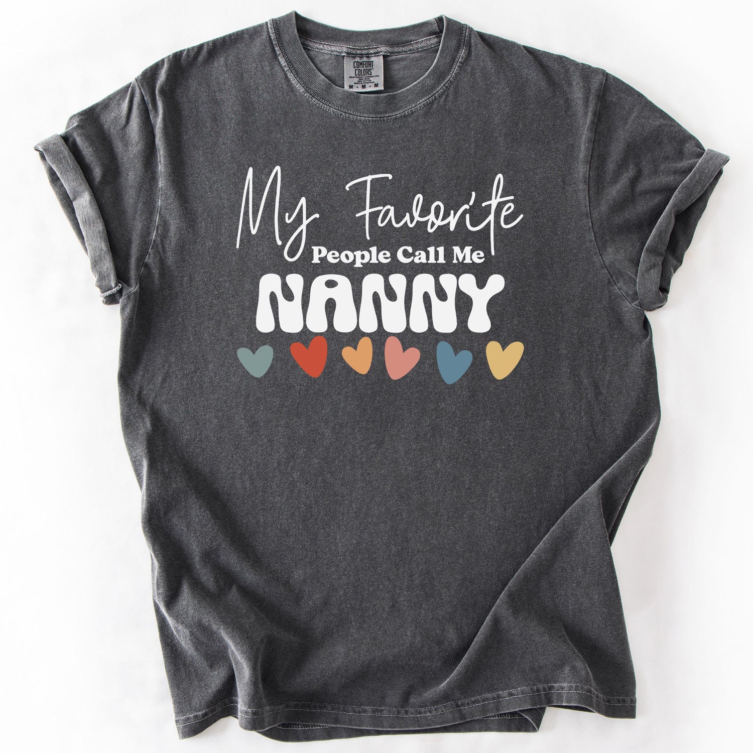 Charcoal gray, short-sleeve t-shirt with My Favorite People Call Me Nanny text and colorful hearts design.