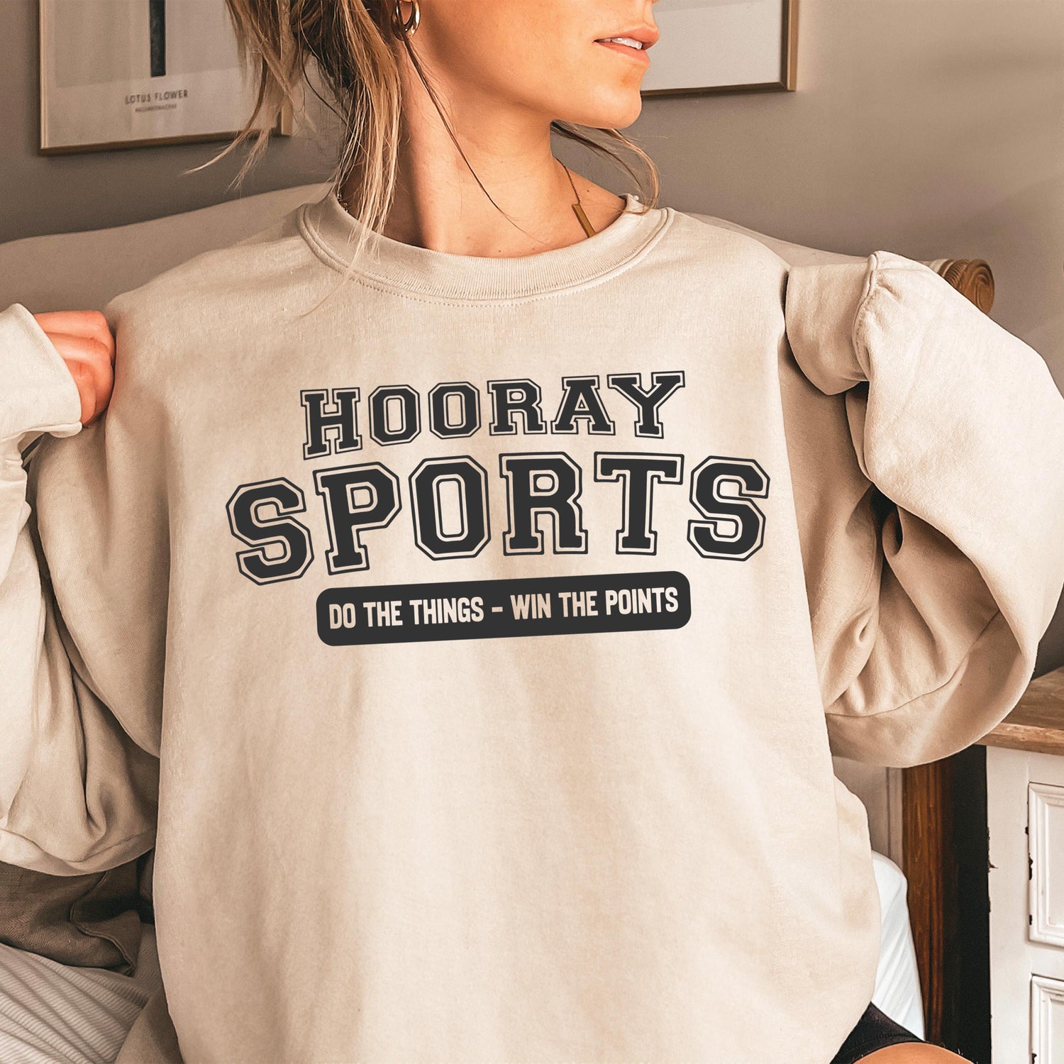 Beige oversized sweatshirt with Hooray Sports text.