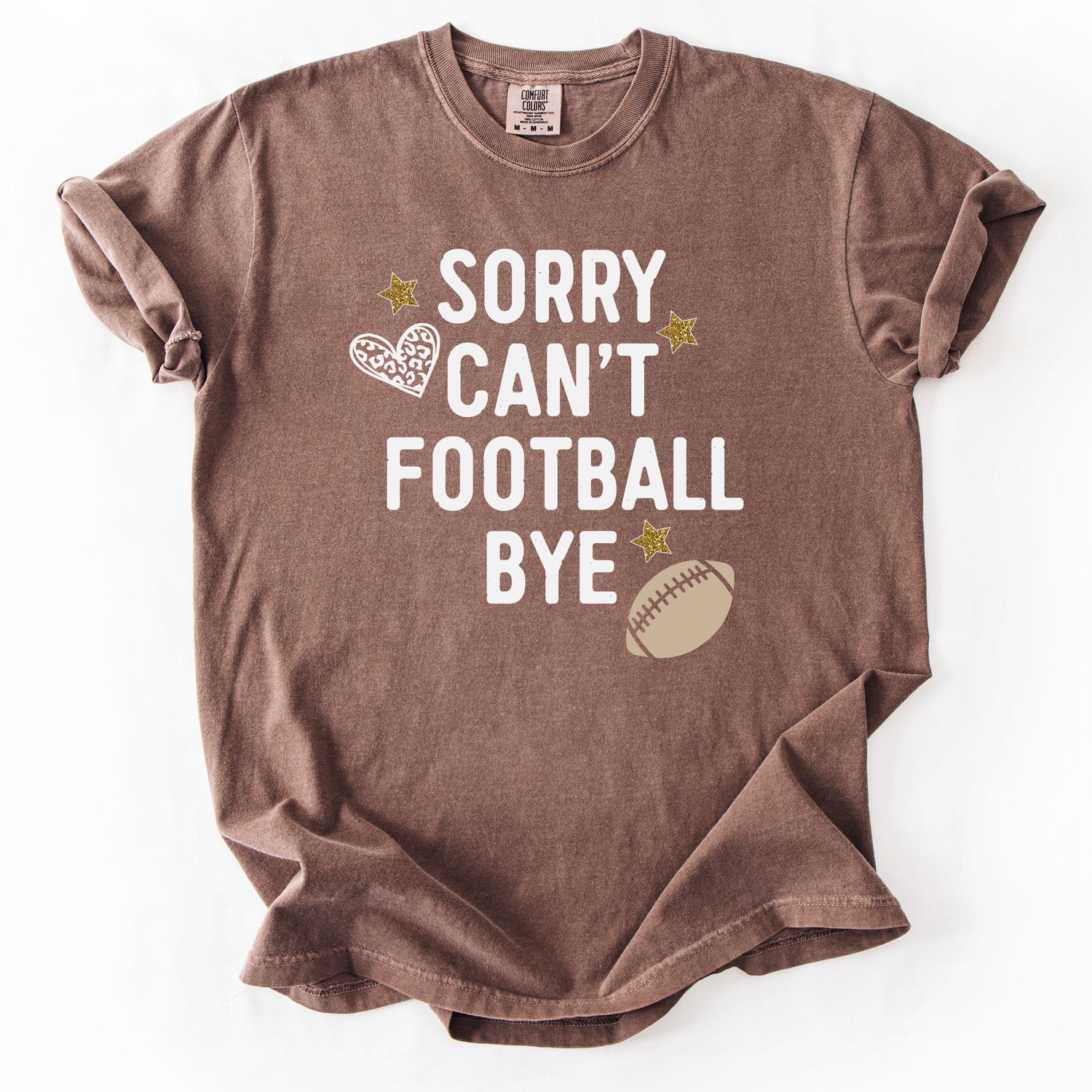 Brown t-shirt with Sorry Can't Football Bye graphic design.